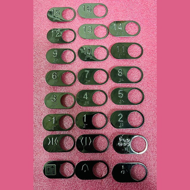 Чиклет овальный с кодом Брайля, тёмная зеркальная поверхность, отверстие 27.5 мм, Gen2 CAA396BN Otis